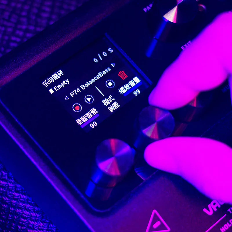 A sleek black valeton gp-100 electric guitar comprehensive effects pedal with digital display and bass drum machine features