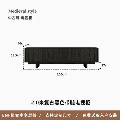 Black medieval-style tv cabinet with wavy wood grain detailing and sturdy legs vesa floor aesthetic vintage living stand