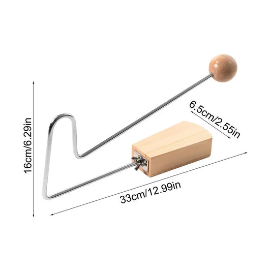 A sleek silver vibraslap instrument with a light wood handle, perfect as a unique musical loud percussion instrument wood