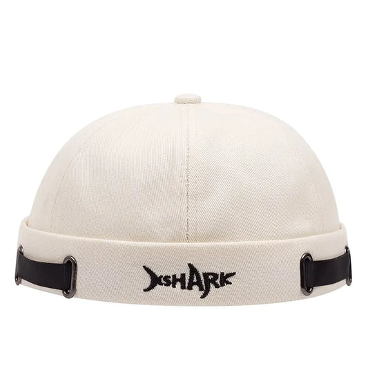 Off-white cotton vintage brimless hat featuring breathable shark beanie design with adjustable docker cap strap accents