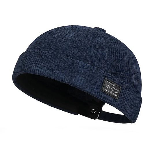 Dark blue corduroy vintage men’s summer cotton brimless skullies cap with ribbed texture and black interior lining