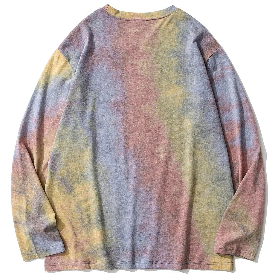 A soft vintage oversized long sleeve cotton tee in pastel tie dye blending lavender yellow and muted pink hues