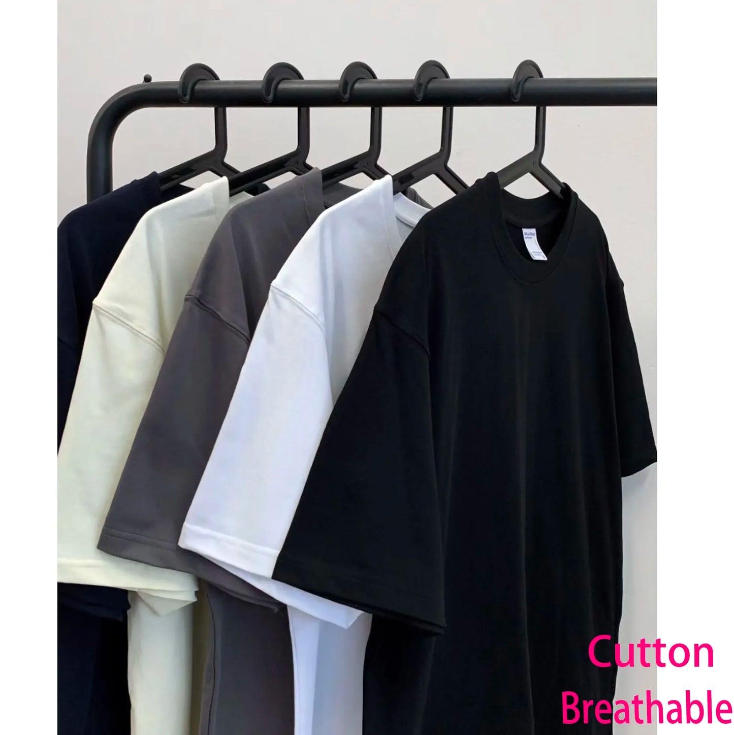 Black cotton t shirt with relaxed fit and short sleeves featuring vintage phantom washed stretched streetwear design