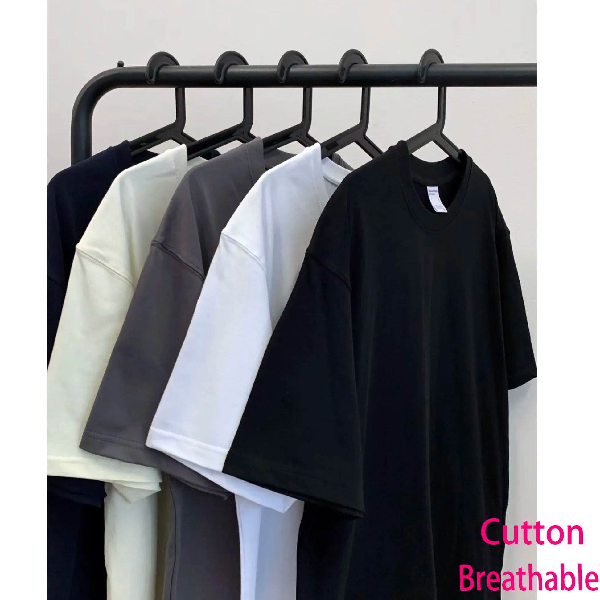 Black cotton t shirt with relaxed fit and short sleeves featuring vintage phantom washed stretched streetwear design