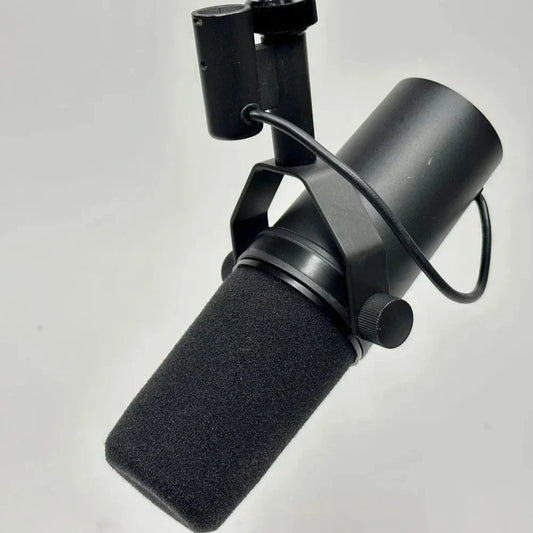Black vocal microphone sm7b with foam windscreen and metal stand mount for broadcast podcasting recording gaming streaming