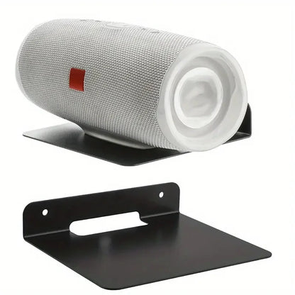 Silver mesh jbl charge 4 speaker resting on a black metal floating bracket speaker wall bracket for placing small speakers