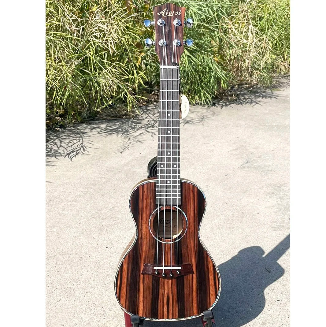 A sleek java ebony concert ukulele with glossy dark wood grain and silver tuning pegs wholesale price aiersi china string instrument