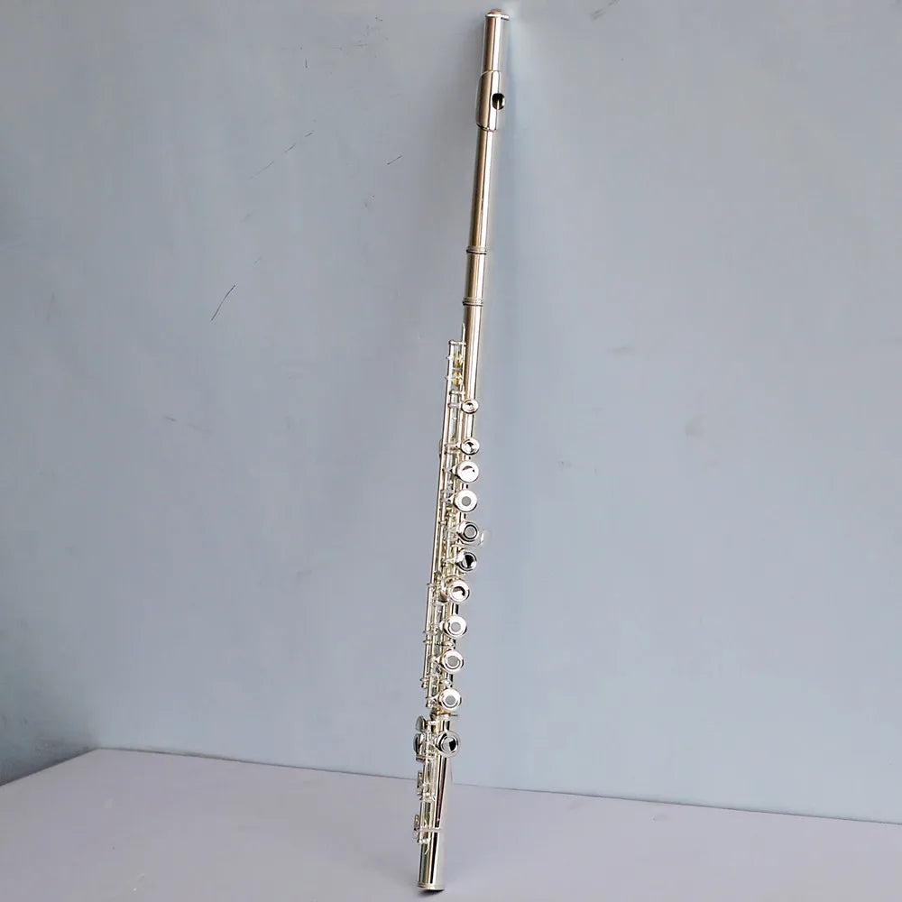 Silver-plated hole performance flute with sleek polished finish and intricate keywork for design wind instruments