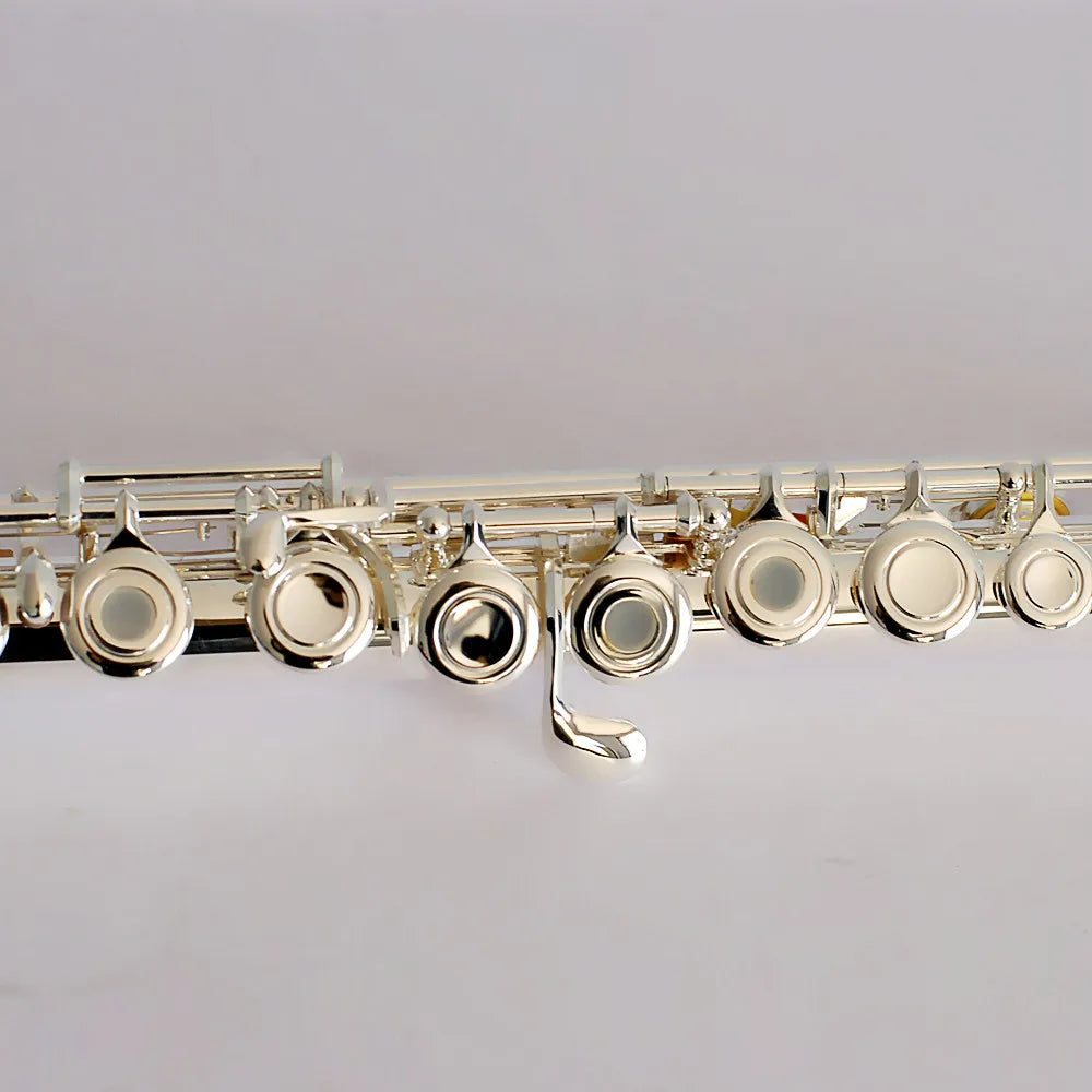 Silver-plated hole performance flute with sleek polished finish and intricate key mechanisms for design wind instruments