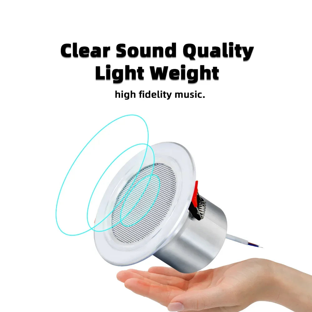 Silver cylindrical mini stereo ceiling speaker with perforated grille and visible internal components for wifi bluetooth wall use