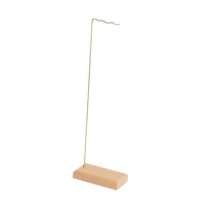 Minimalist gold-toned metal wind chime stand with rectangular wooden base and wavy hook for wedding event home decor