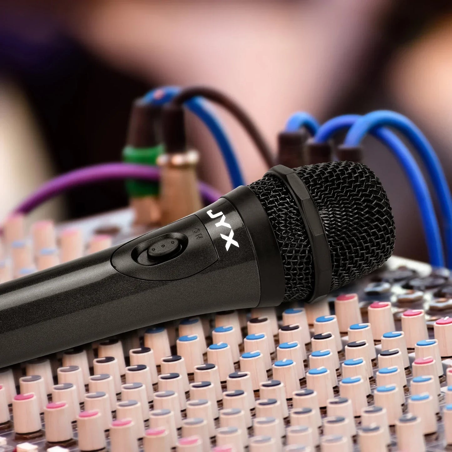 Black wired dynamic super-cardioid vocal microphone handheld with mesh grille and textured grip for live vocals karaoke