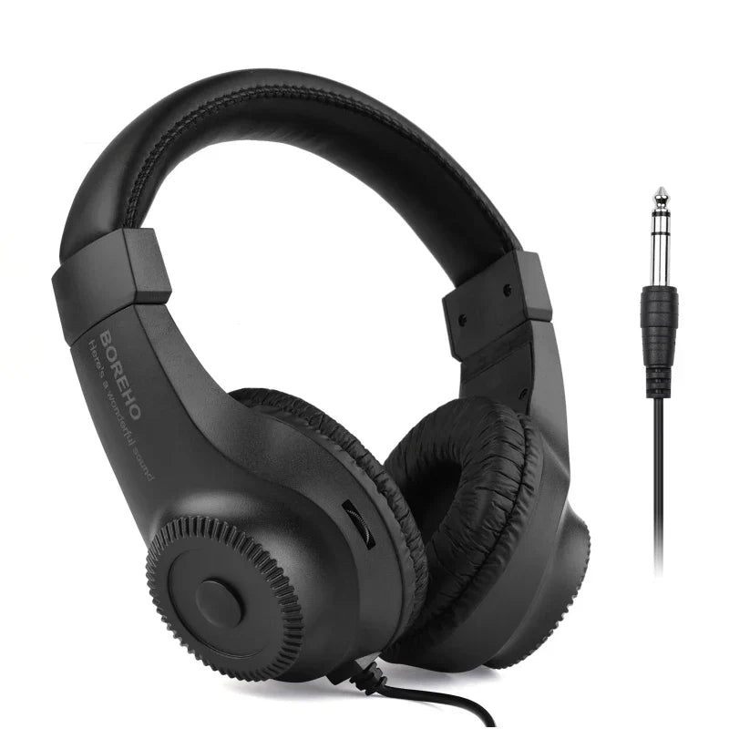 Black wired stereo monitor over-ear headphones with padded earcups 50mm driver and coiled cable for guitar amplifier electric and piano audio mixer
