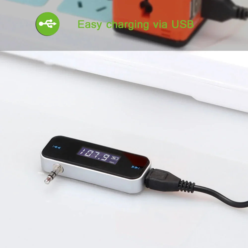 Silver and black wireless audio fm transmitter with digital lcd display 107.9 fm aux input and usb charging cable for handsfree car mp3 use