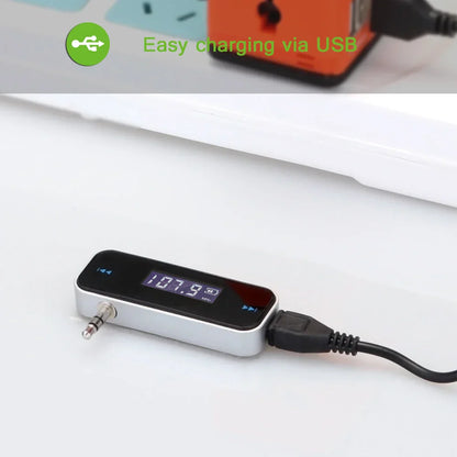 Silver and black wireless audio fm transmitter with digital lcd display 107.9 fm aux input and usb charging cable for handsfree car mp3 use