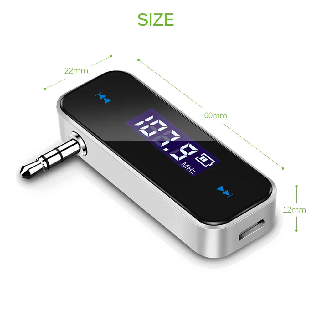 Silver handsfree car mp3 transmitter with black lcd display, 3.5mm audio jack, usb port, and audio fm transmitter features