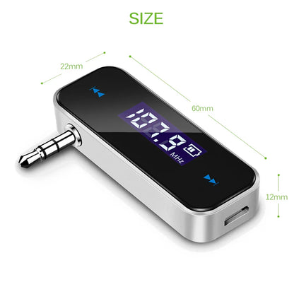 Silver handsfree car mp3 transmitter with black lcd display, 3.5mm audio jack, usb port, and audio fm transmitter features