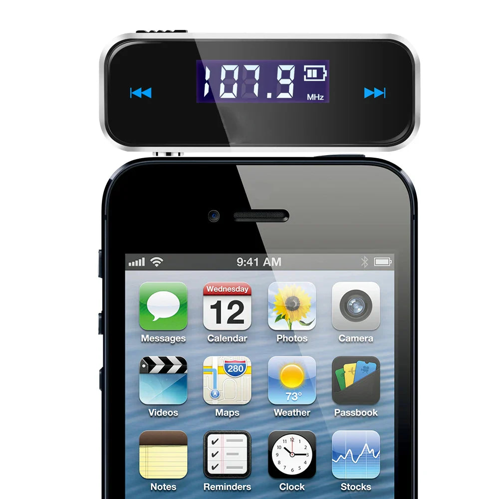 Black and silver wireless 3.5mm audio fm transmitter with blue lcd display showing 107.9 mhz for handsfree car mp3 use