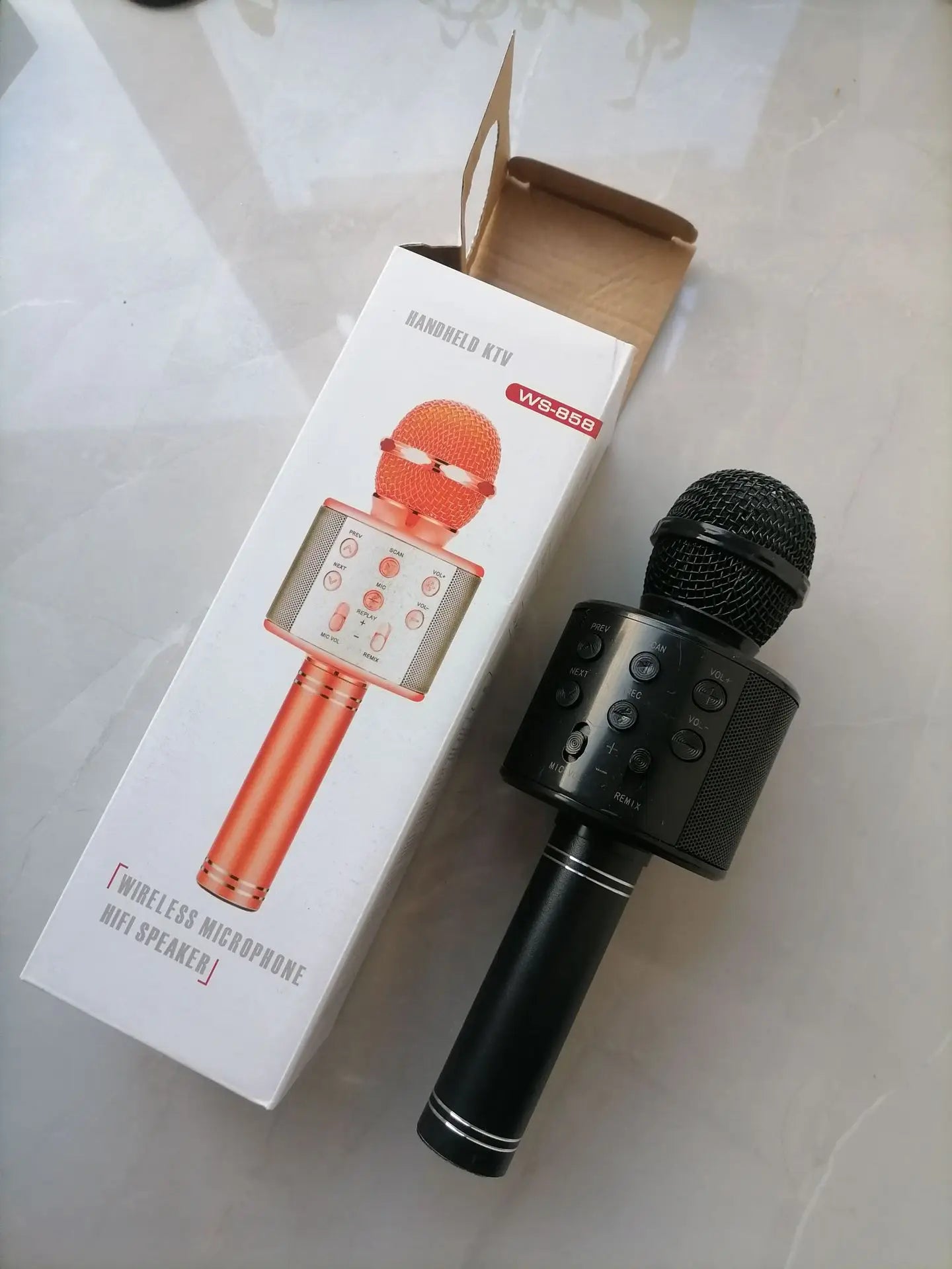 Black wireless bluetooth k12 microphone with speaker and textured grille for adults karaoke microphone and portable party use