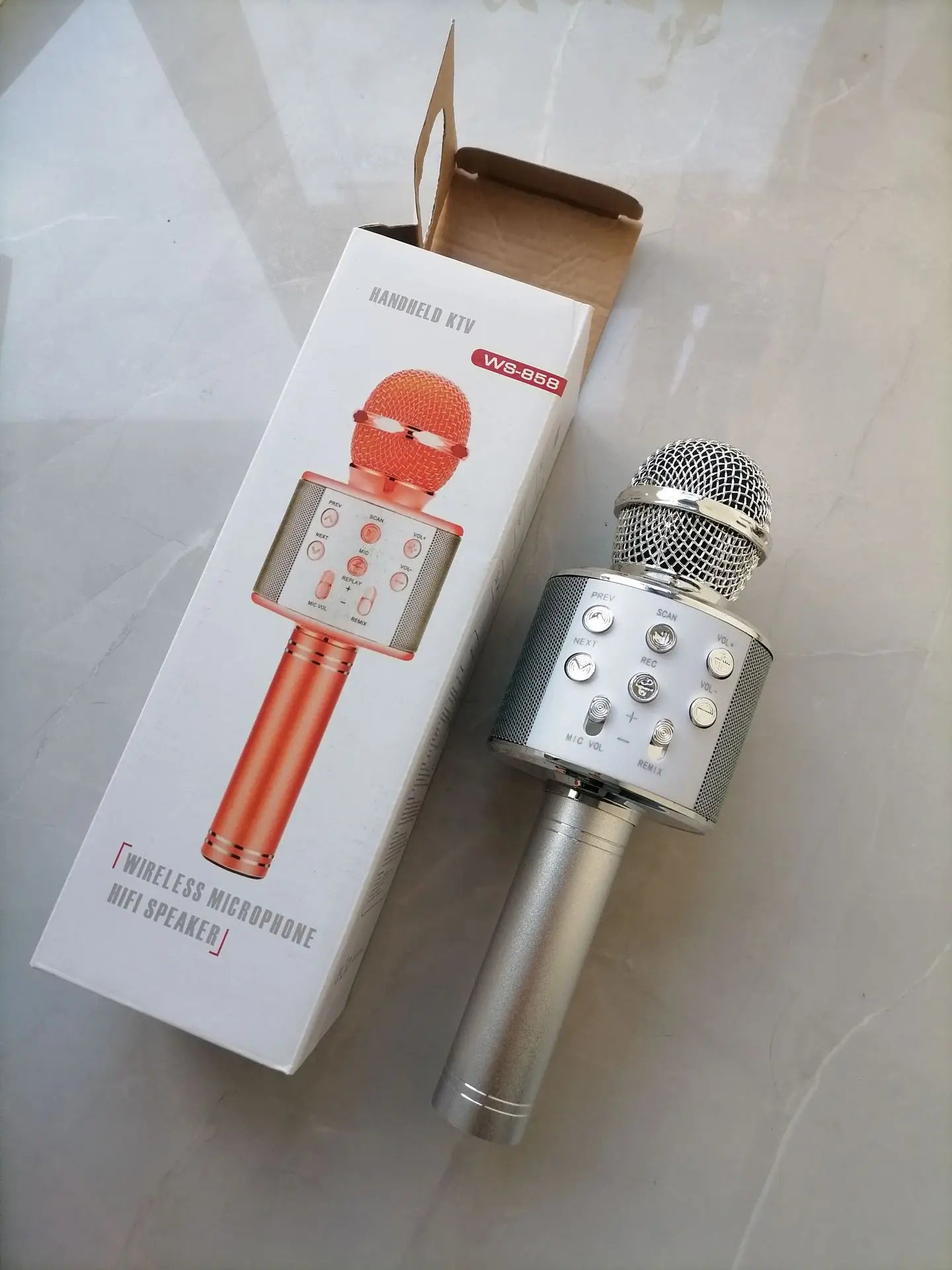 Silver wireless bluetooth k12 handheld microphone with mesh grille and control buttons for adults karaoke and portable party use