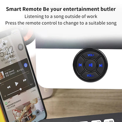 Black circular wireless bluetooth remote with blue illuminated buttons for volume and track navigation on bike steering wheel