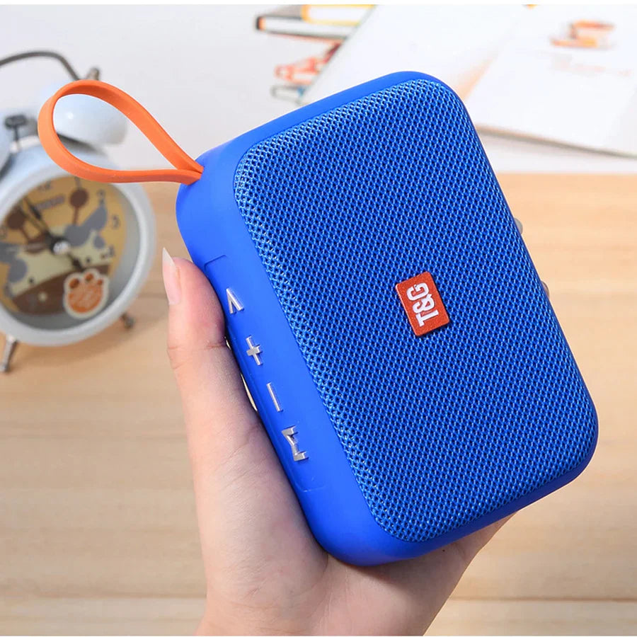 Blue tsc wireless bluetooth speaker with orange carrying loop and textured mesh grille radio fm waterproof small subwoofer sound