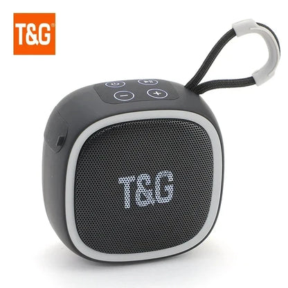 Black and gray wireless bluetooth speaker with textured grille control buttons and carrying loop radio fm waterproof small subwoofer sound