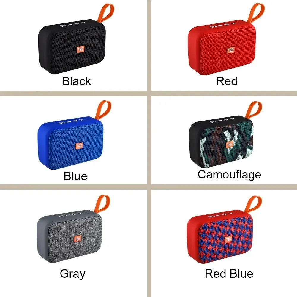 Compact wireless bluetooth speaker with textured fabric exterior and orange loop for radio fm waterproof use and small subwoofer sound