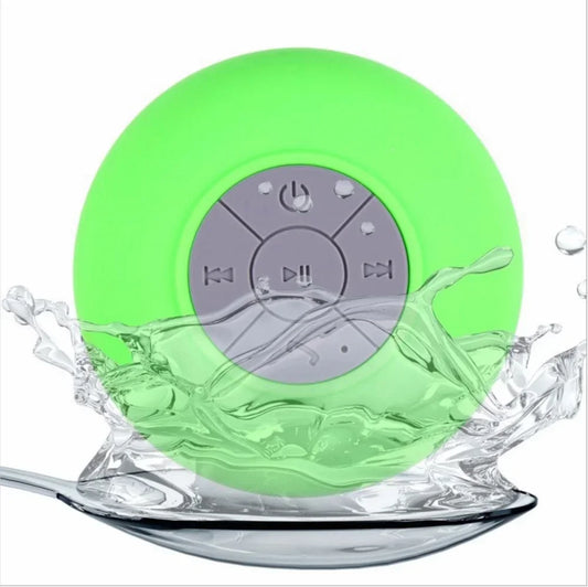 Bright green round wireless bluetooth waterproof speaker with gray control panel and suction cup for car and shower use