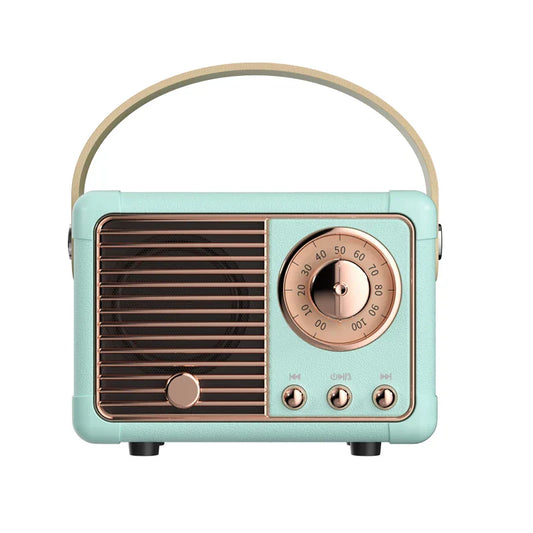 Retro-style mint green som portable bluetooth speaker with rose gold dial and curved handle for handfree mini subwoofer use