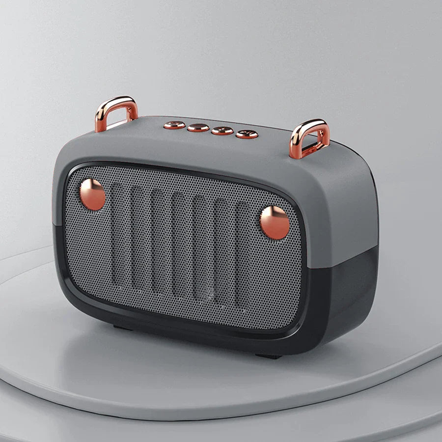 Gray and black retro-style som portable bluetooth speaker with rose gold accents and handfree mini subwoofer feature