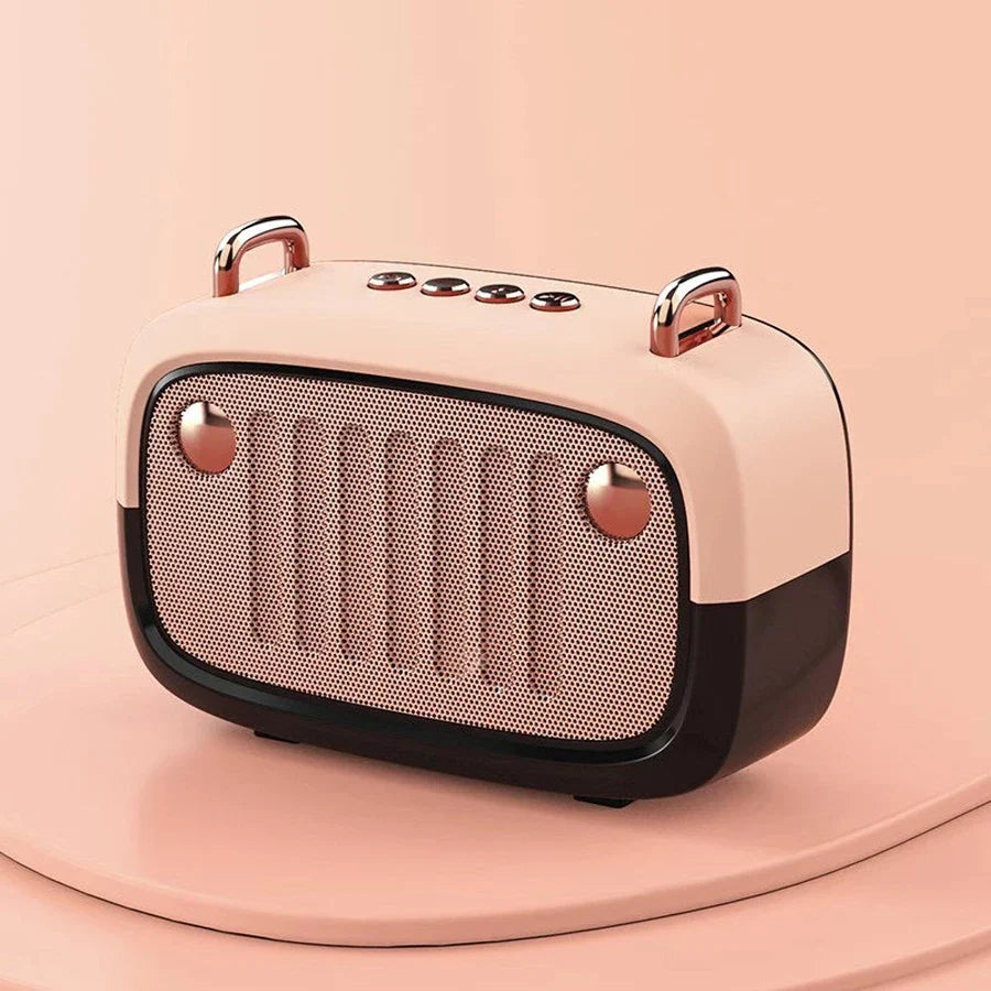 Pastel pink and black retro-style som portable bluetooth speaker with rose gold accents and handfree mini subwoofer features