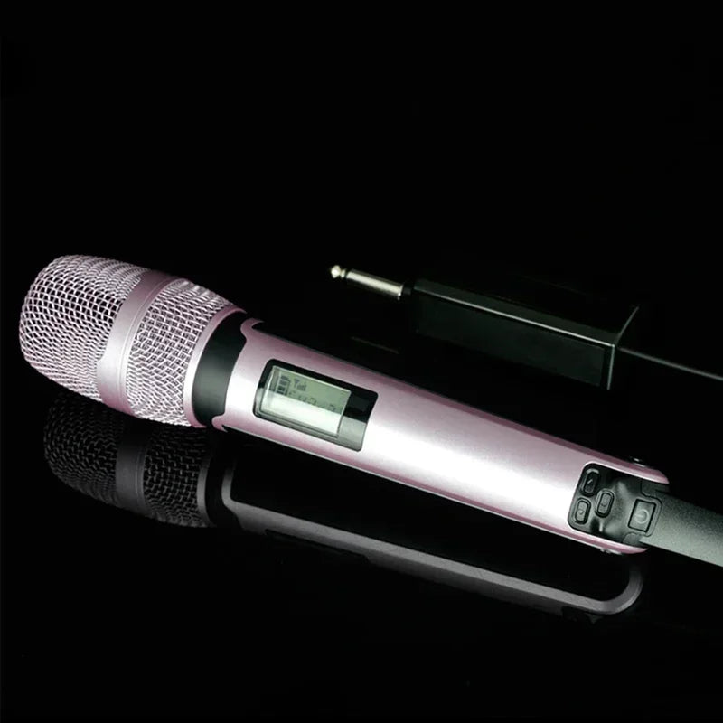 Pink wireless karaoke microphone dynamic with metallic mesh grille and digital display for professional DJ conference use