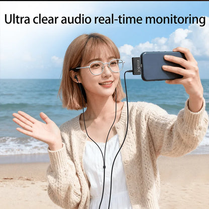 Black wired earphones with compact audio monitoring device attached to phone showing wireless lavalier microphone usb c with replaceable windproof wool