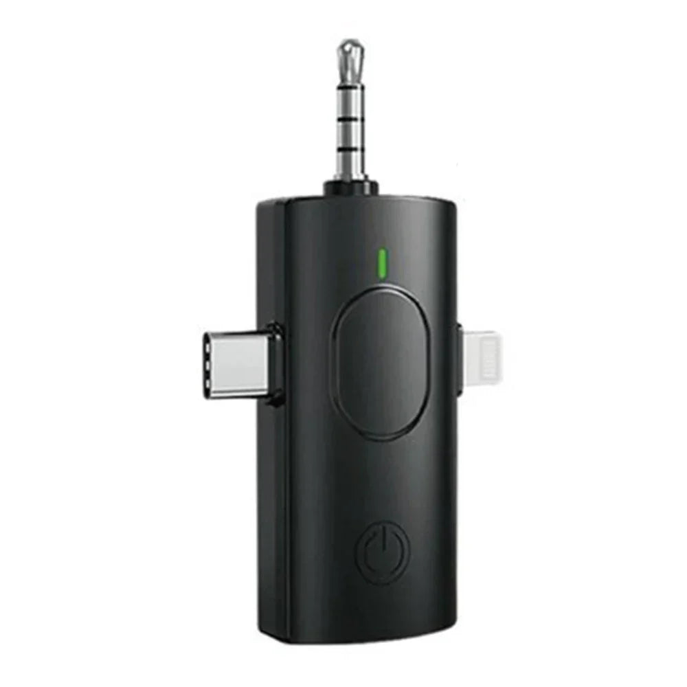Black wireless audio adapter with green power indicator usb-c lightning ports and 3.5mm jack for wireless lavalier microphones and noise reduction