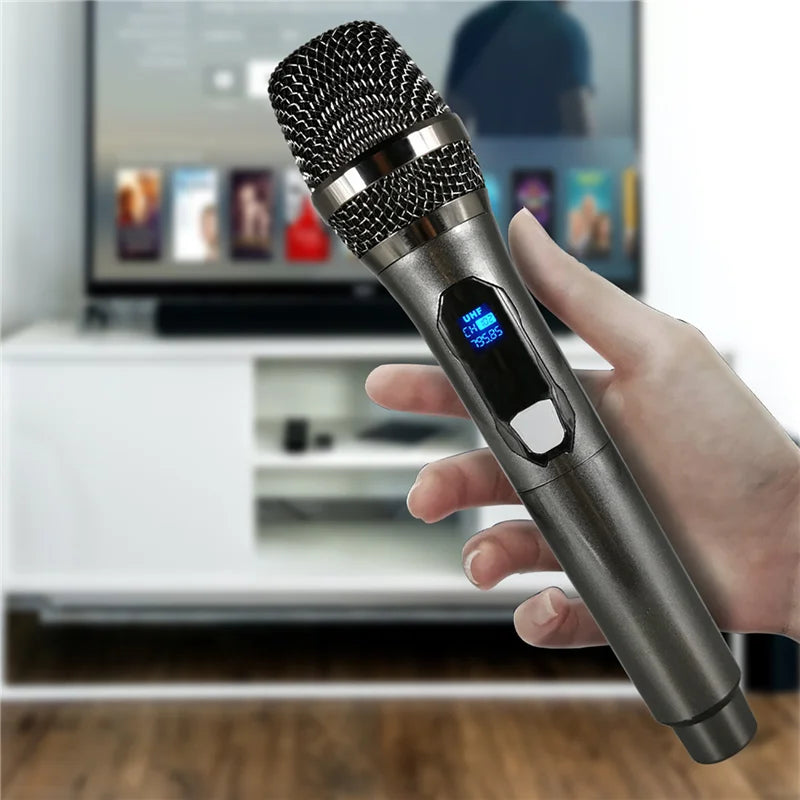 A sleek metallic gray wireless karaoke microphone with mesh grille and rechargeable lithium battery for party home meeting church school use
