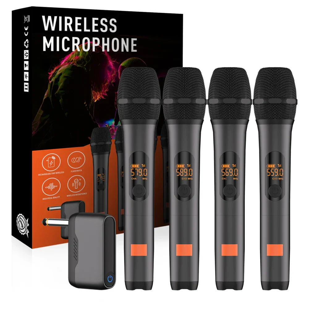 Set of four black wireless microphones with orange accents digital displays and lithium battery receiver for party church speaker