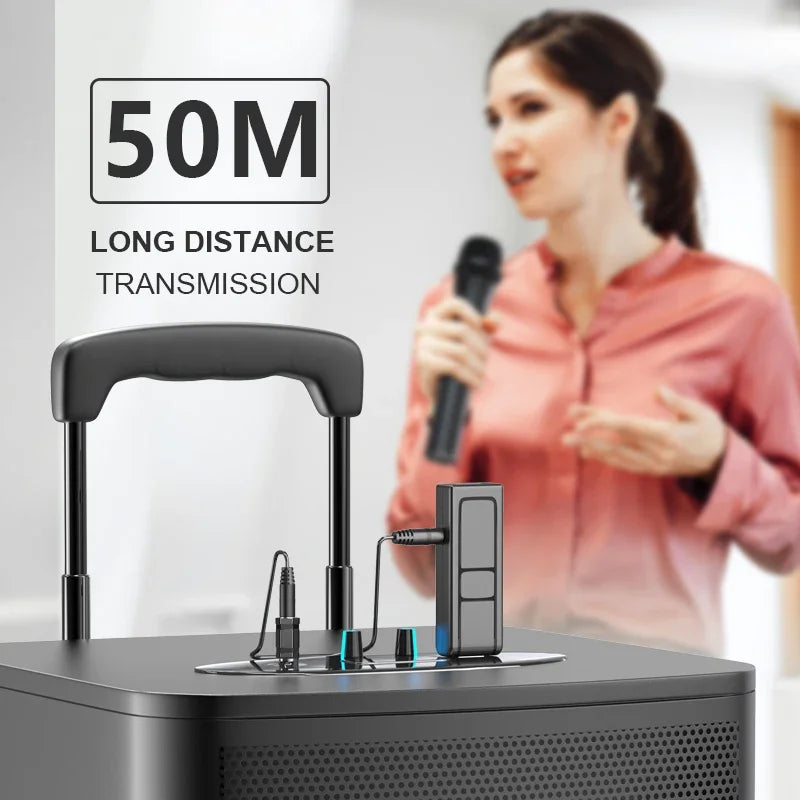 Black portable speaker with handle and perforated front panel featuring wireless microphone transmitter for karaoke microphone home use