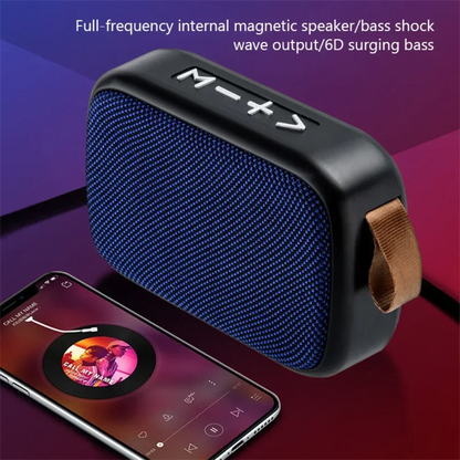 Wireless mini bluetooth speaker with blue textured fabric, black plastic casing, and brown leather strap for outdoor use