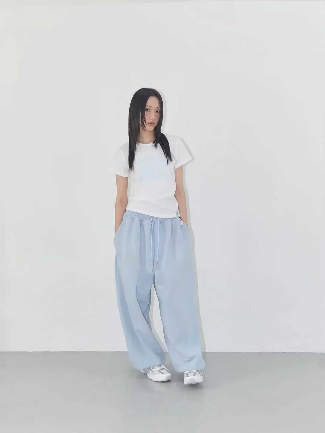 Light blue wide-leg joggers with drawstring waistband designed for casual street dance and athletic use