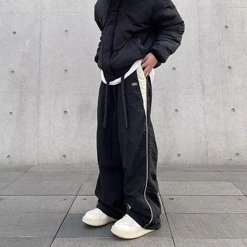 Black wide-leg women casual joggers with white side stripe and drawstring waistband for hip hop y2k streetwear
