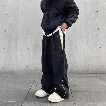 Black wide-leg women casual joggers with white side stripe and drawstring waistband for hip hop y2k streetwear