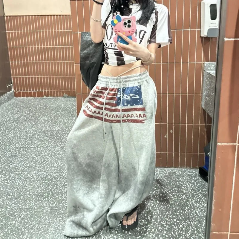 Gray cotton wide leg sweatpants with faded american high street flag print and drawstring waistband for versatile sports use