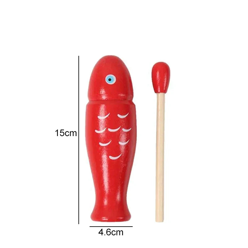 Red wooden fish orff percussion instrument with white scales and blue eye and matching red-tipped mallet for beginners