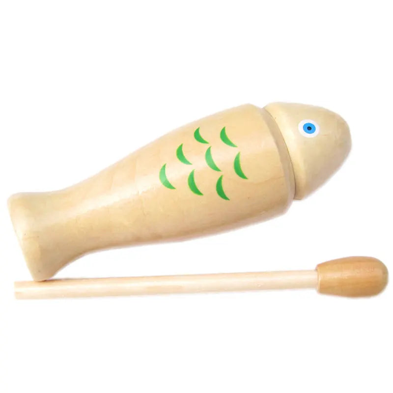Light-colored wooden fish orff percussion instrument with green scales and blue eye with matching mallet for beginners