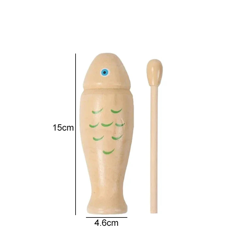 Light-colored wooden fish orff percussion instrument with green scales and blue eye with matching mallet for beginners