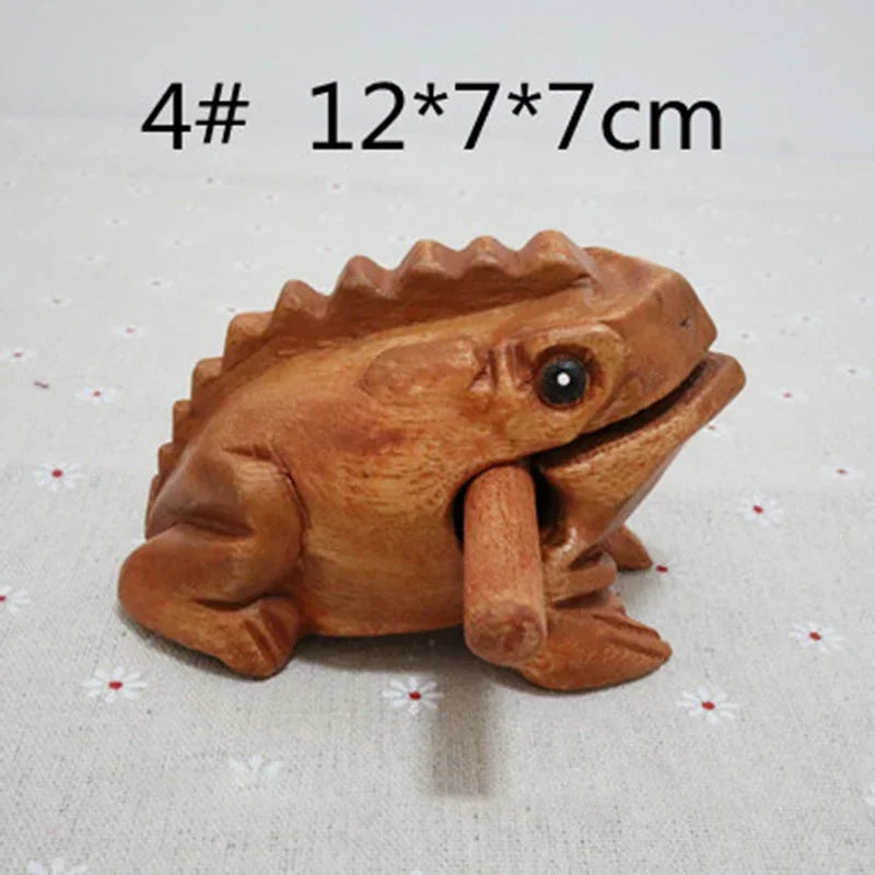 Hand-carved wooden lucky frog with smooth warm brown finish and detailed features croaking musical instrument decor