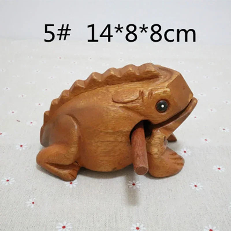 Hand carved wooden lucky frog percussion instrument with warm brown finish and detailed sculpted features for decor or play