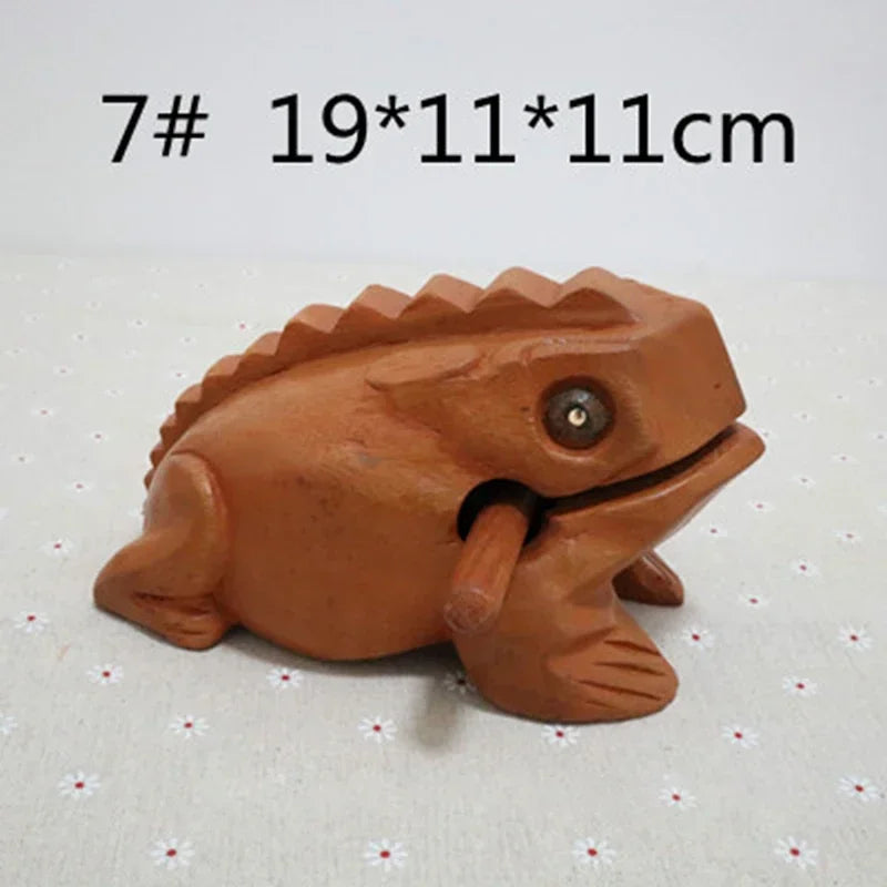 Terracotta wooden lucky frog figurine with carved spine and glossy black eye croaking musical instrument decor