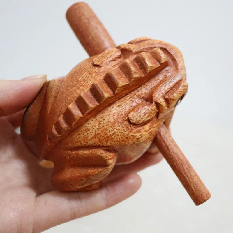 Hand-carved wooden lucky frog nutcracker with detailed texture and natural wood grain croaking musical instrument